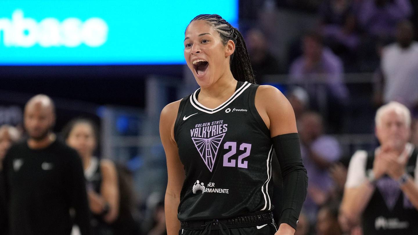 Veronica Burton celebrates in a Golden State Valkyries uniform