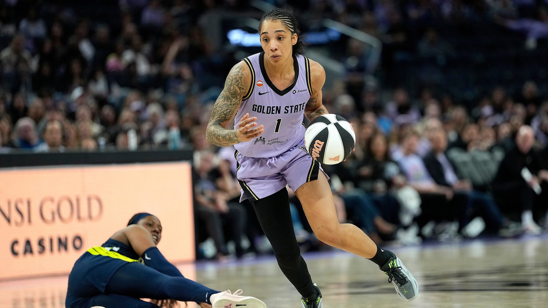 Gabby Williams of the Golden State Valkyries pushes the ball up court against Dallas