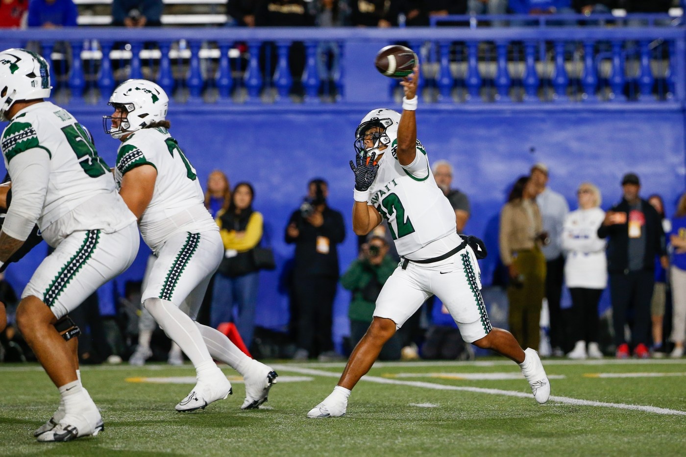 Micah Alejado throws a pass for the Hawai'i Rainbow Warriors